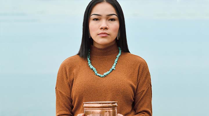Person holding a copper piece