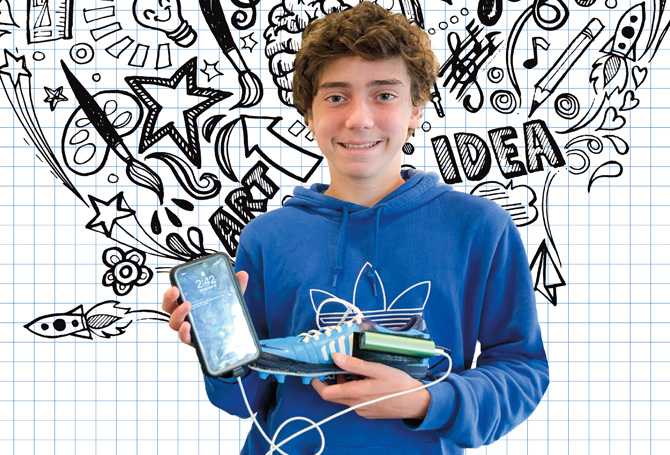 Kid holding phone and shoe with charger connected to it; in front of a grid background with sketches